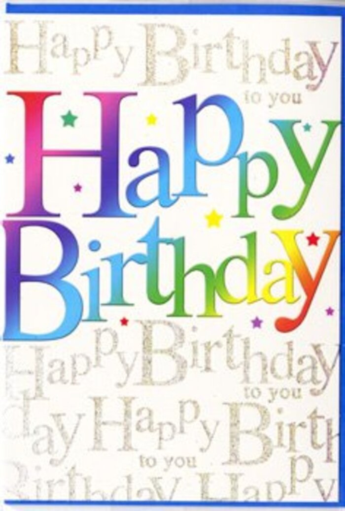 The image shows a single birthday card whose front is an unapologetic celebration of colour, reminiscent of the lively murals and shopfronts scattered around Kentish Town. The central focus is the phrase Happy Birthday, written in large, confident letters that arc gently across the card face, as if lifting in mid-air like balloons. Each character is filled with a smooth gradient, moving through bold, saturated hues-deep raspberry red, tangy orange, lemon yellow, fresh lime, leafy green, and cool turquoise-before fading into rich indigo and violet near the edges. These shifts in colour are seamless, without harsh lines, giving the impression of a professionally printed, high-gloss finish that would feel sleek and smooth when touched. Behind the dominant wording, the entire background is alive with a softer, looping script that continually repeats Happy Birthday to you in fine golden lettering, much like a gently sung chorus drifting out of a party venue near Tufnell Park. The script is more delicate and slightly blurred compared with the foreground text, so it acts like a decorative pattern rather than a competing message, shimmering subtly as if inked with metallic foil. Between and around the letters, subtle flecks of colour-tiny dots and miniature bursts-dot the surface like confetti tossed into the air at the moment candles are blown out. The card is photographed in even, natural light, without harsh reflections, so its layered design and vibrant palette are clearly visible. The mood is upbeat and affectionate, perfect for marking a special birthday with as much warmth and brightness as a festive evening along Kentish Town Road.